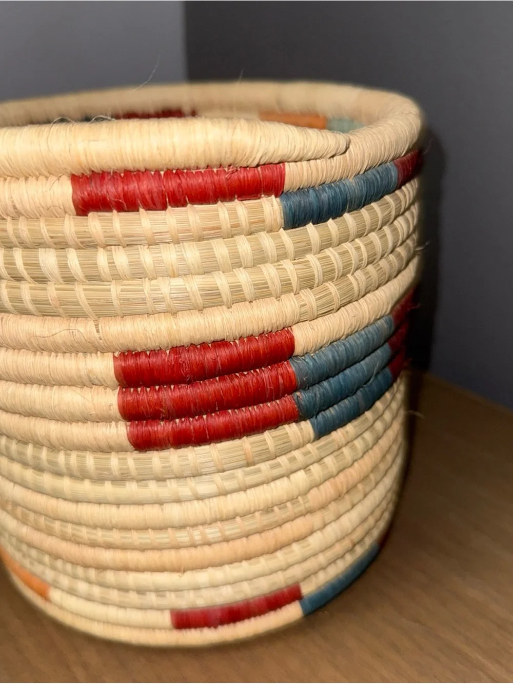 Handwoven Natural Basket with Red and Blue Accents